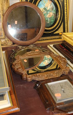 Lot 1055 - A walnut framed circular wall mirror, dia....