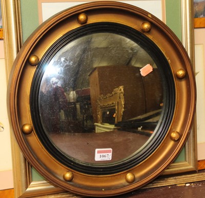 Lot 1067 - A gilt framed convex wall mirror dia. 35cm,...