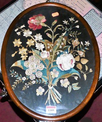 Lot 1109 - A Victorian silkwork panel depicting wild...