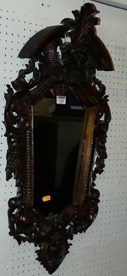 Lot 1141 - A circa 1900 continental carved fruitwood wall...