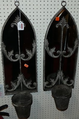 Lot 1144 - A pair of metal framed garden mirrors, each...