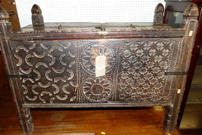 Lot 1150 - A Middle Eastern blind carved hardwood coffer,...