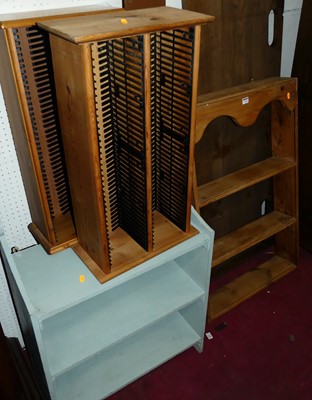 Lot 1156 - A pine three-tier wall shelf; two modern pine...
