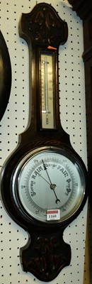 Lot 1160 - A carved oak two-dial aneroid wheel barometer,...