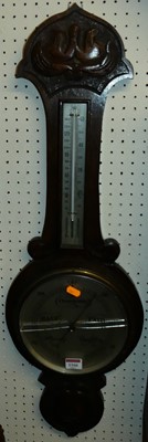 Lot 1166 - A carved oak two-dial aneroid wheel barometer,...