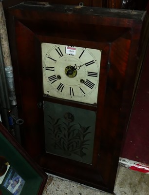 Lot 1169 - An American mahogany wall clock, h.65cm