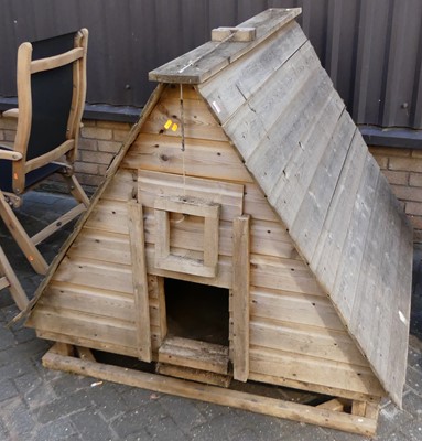 Lot 1178 - A boarded pine chicken coop, with rise and...