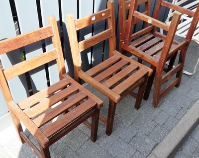 Lot 1184 - A set of four Lister slatted teak garden side...
