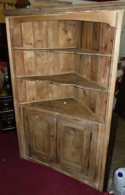 Lot 1188 - A pine freestanding corner cupboard, the...
