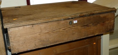 Lot 1194 - A rustic pine slope front table top hinged...