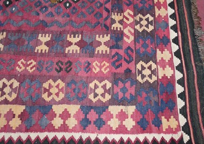 Lot 1200 - A Turkish woollen kilim rug, the repeating...
