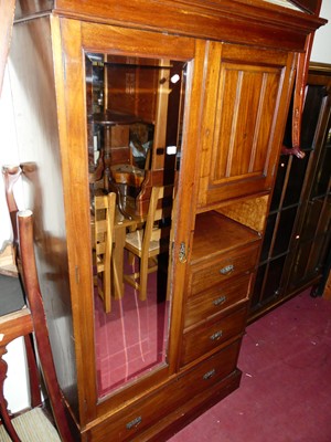 Lot 1219 - An Edwardian walnut compactum wardrobe, having...