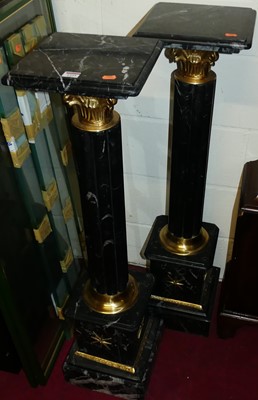 Lot 1225 - A pair of contemporary black variegated marble...