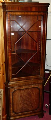 Lot 1235 - A contemporary mahogany freestanding corner...