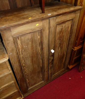 Lot 1248 - A pitched pine double door side cupboard, with...
