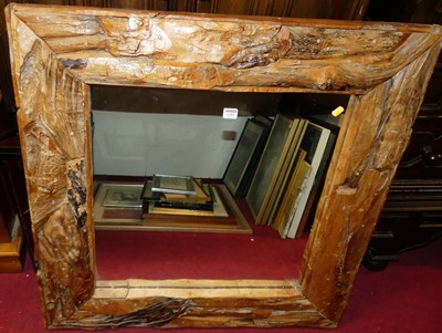 Lot 1251 - A contemporary square wall mirror, housed in...