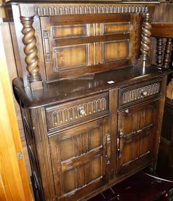 Lot 1252 - A contemporary dark elm court cupboard, of...