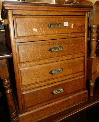 Lot 1258 - An early 20th century oak four drawer office...