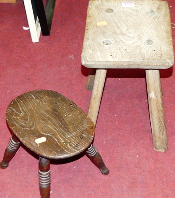 Lot 1259 - Two 19th century elm milking stools