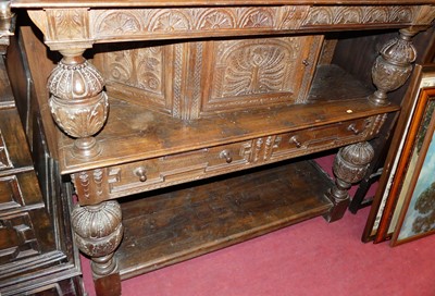 Lot 1261 - A 17th century style heavily floral relief...