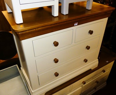 Lot 1320 - A contemporary oak and white painted low chest...
