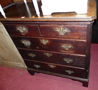 Lot 1278 - A George III oak chest of two short over three...