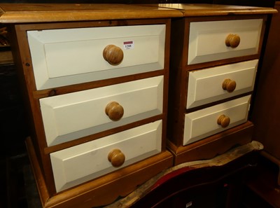 Lot 1288 - A pair of modern pine and painted three drawer...
