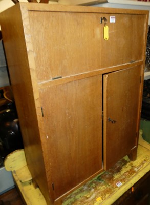 Lot 1297 - A 1970s light oak student's bureau, with fall...