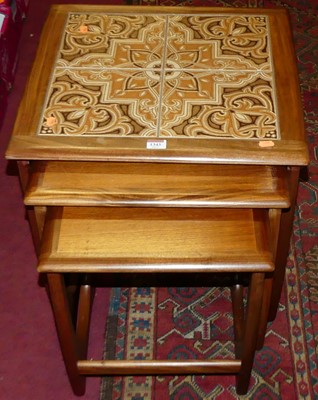 Lot 1343 - A 1960s G-Plan teak and tiled inset nest of...