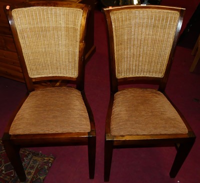 Lot 1348 - A set of eight contemporary teak, wicker inset...