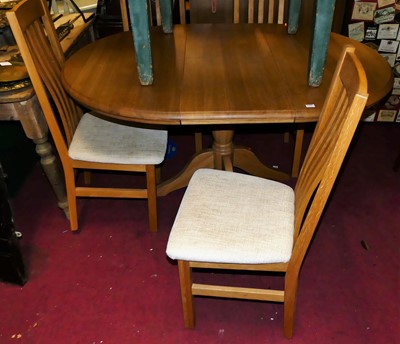 Lot 1352 - A contemporary light oak dining suite,...