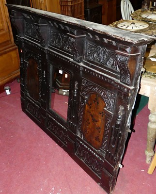 Lot 1353 - An antique floral relief carved oak overmantel...