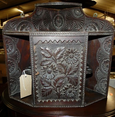 Lot 1375 - An early 20th century floral relief carved oak...