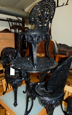Lot 1394 - A contemporary black painted floral pierced...