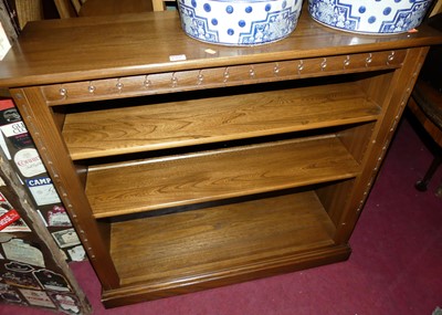 Lot 1400 - A contemporary Ercol mid elm low freestanding...