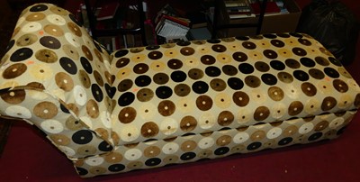 Lot 1412 - A contemporary upholstered hinge top day bed,...