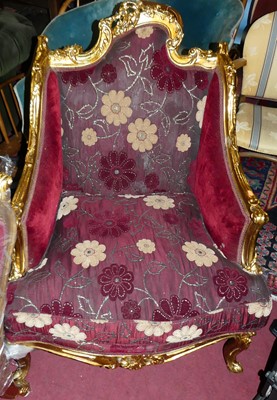 Lot 1437 - A pair of French Regence style floral gilt...
