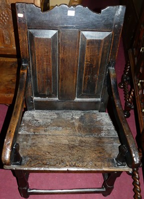 Lot 1454 - An antique joined oak twin panel back and...