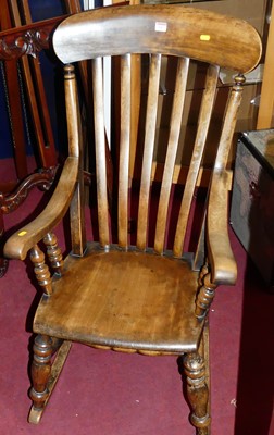 Lot 1457 - An early 20th century elm and beech slatback...