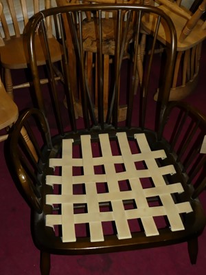 Lot 1458 - An Ercol dark elm stickback low armchair, w.80cm