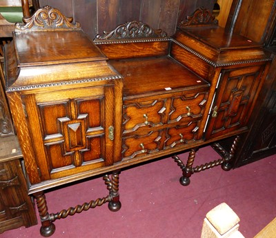 Lot 1470 - An early 20th century geometric moulded oak...