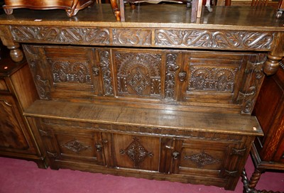 Lot 1473 - A 17th century style joined and floral relief...