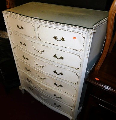 Lot 1479 - A French white wood serpentine front chest, of...