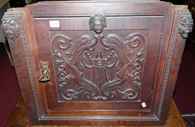 Lot 1481 - An early 20th century carved oak single door...