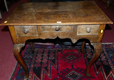 Lot 1482 - A 19th century oak three drawer lowboy, on...