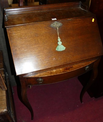 Lot 1487 - A circa 1900 French oak three-quarter gallery...
