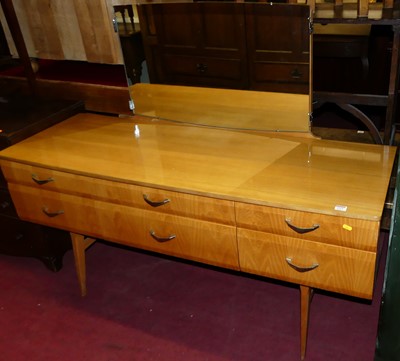 Lot 1519 - A 1970s laminate mirror back long dressing...