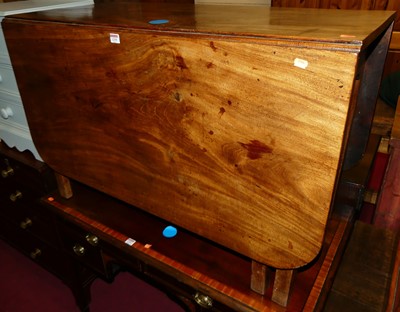 Lot 1295 - An early 19th century round cornered drop leaf...