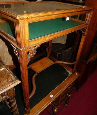 Lot 1306 - A circa 1900 oak and glazed hinge topped...