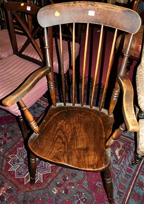 Lot 1401 - An early 20th century elm and beech stick back...